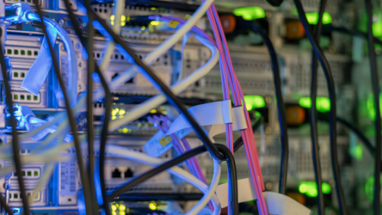 Colourful data cables and servers in the background.
